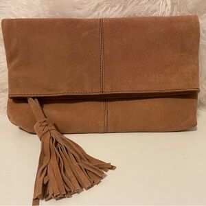 Light brown suede fold-over clutch with tassel and zipper closure